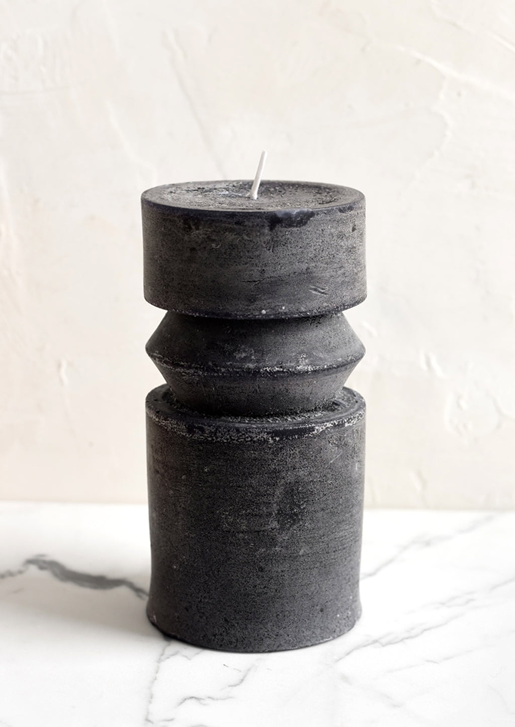 Medium (Ridge) / Black: A medium carved pillar candle with waxy finish in black.