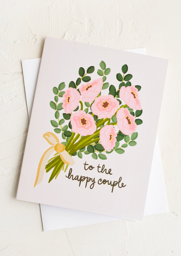 1: A greeting card with bouquet and text reading "to the happy couple".
