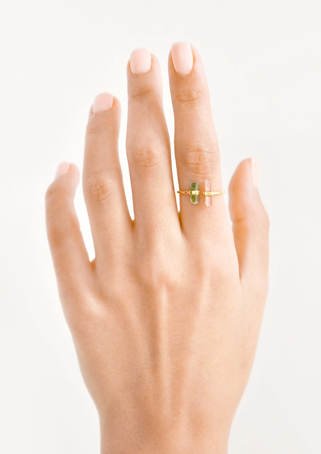 2: Model shot showing hand wearing ring with crystals.
