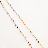 2: A long necklace with multicolor gemstones and tourmaline bezel.