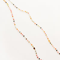 3: A long necklace with multicolor gemstones and tourmaline bezel.