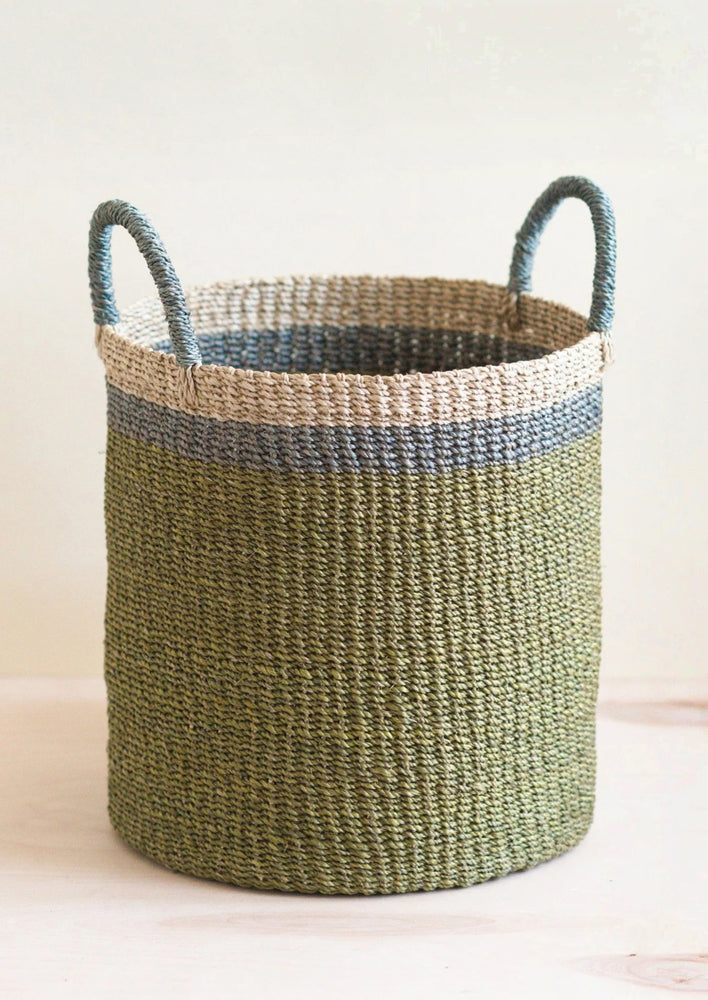 A tri tone storage basket with handles in olive.