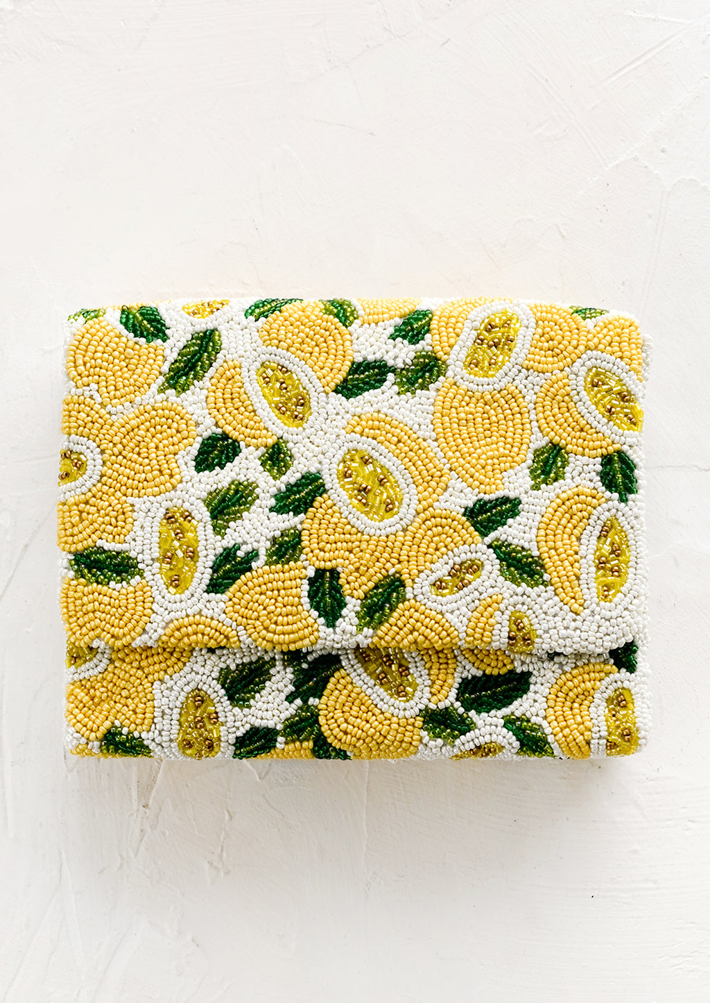 Lemon Multi: A beaded box-shaped clutch with lemon citrus print.