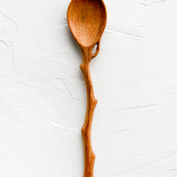 2: A wooden spoon in shape of tree branch.