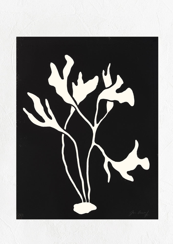 A linocut art print with black background and silhouetted seaweed shape.