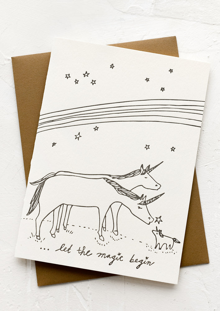 1: A greeting card with illustration of unicorn family, text reads "Let the magic begin".