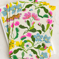 1: A set of notecards with colorful fly trap floral print.
