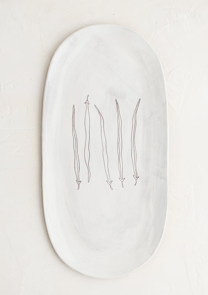 French Beans: An oval shaped ceramic serving platter with hand drawn green beans illustration at center.