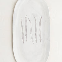 French Beans: An oval shaped ceramic serving platter with hand drawn green beans illustration at center.
