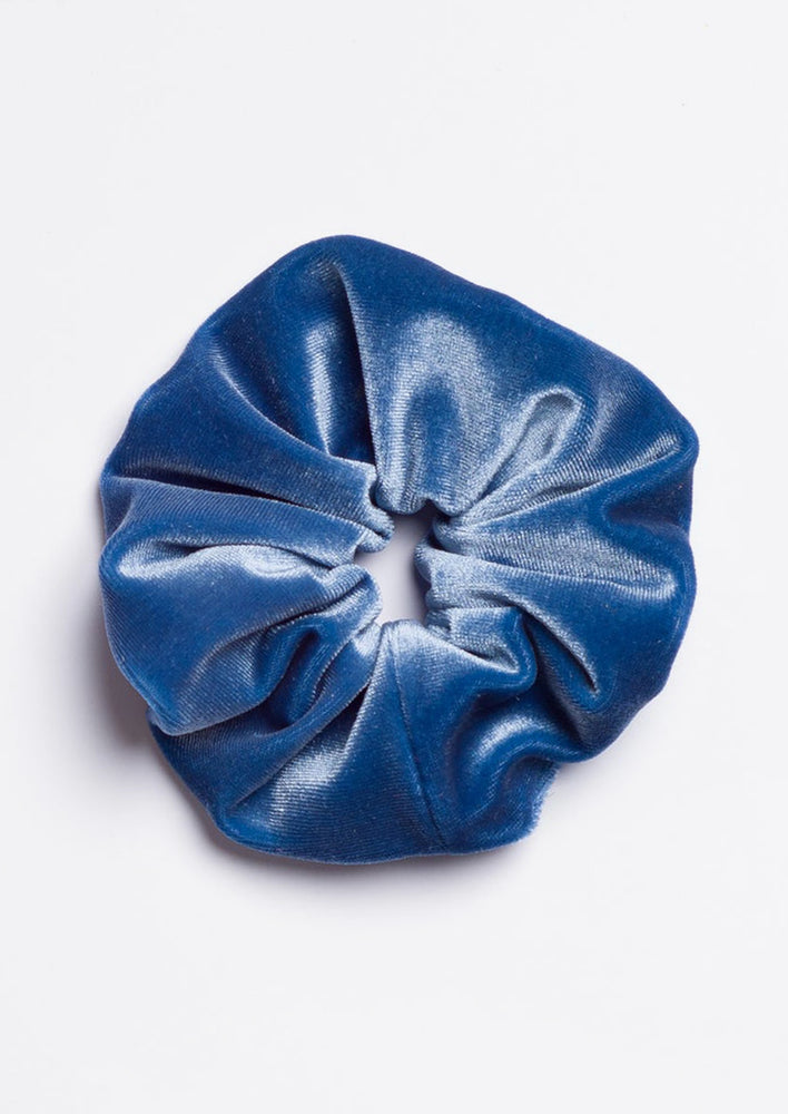 A velvet scrunchie in forget me not blue.