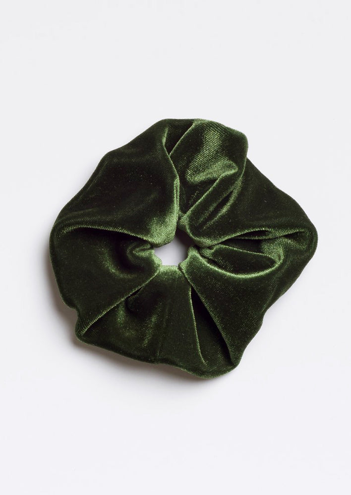 A velvet scrunchie in pine green.