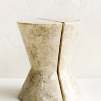 1: A pair of hourglass shaped bookends in tan marble.