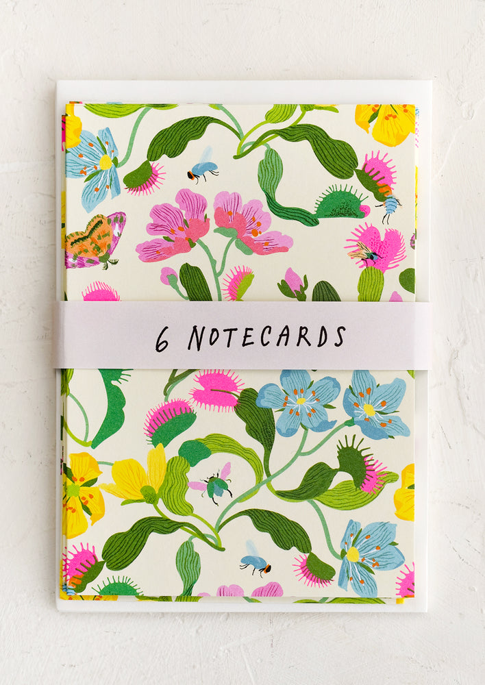 A set of notecards with colorful fly trap floral print.