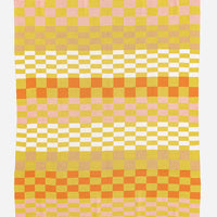 Citron Multi: A knit throw blanket in checker print pattern in citron, tan ,white, pink and orange.