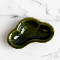 1: A small ceramic dish in cloud shape and glossy olive green glaze.