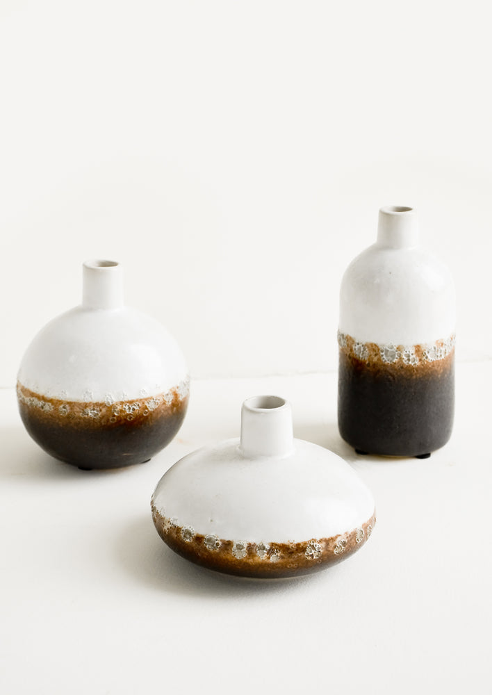 1: Three ceramic bud vases in a mix of shapes and sizes.