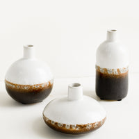 1: Three ceramic bud vases in a mix of shapes and sizes.