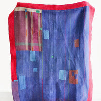 1: Vintage patchwork quilt in a mix of colors and fabrics. Predominantly dark blue with magenta accents.