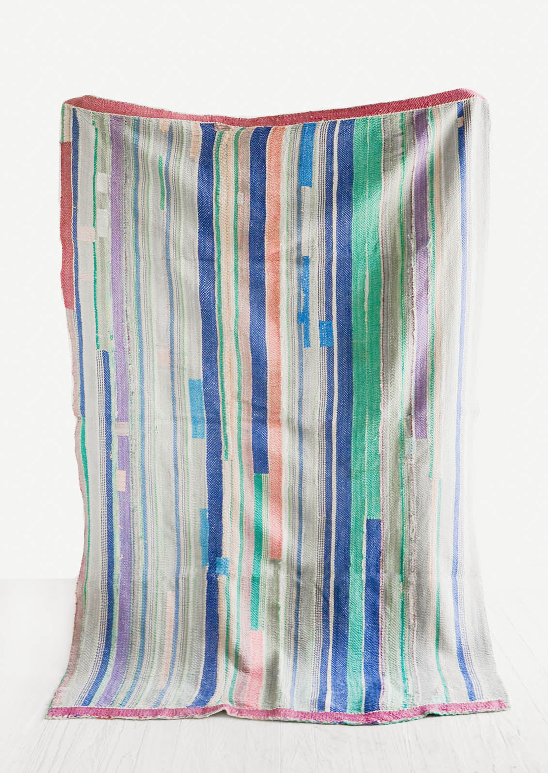 Vintage patchwork quilt in a mix of cool colors and fabrics. Predominantly blue, green, aqua.