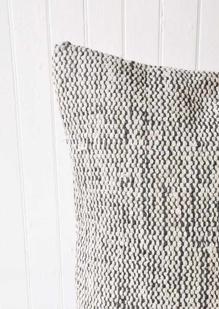 Detail shot of a black and white woven pillow. 