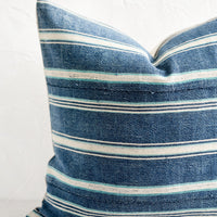 2: A square throw pillow in vintage indigo stripe fabric.