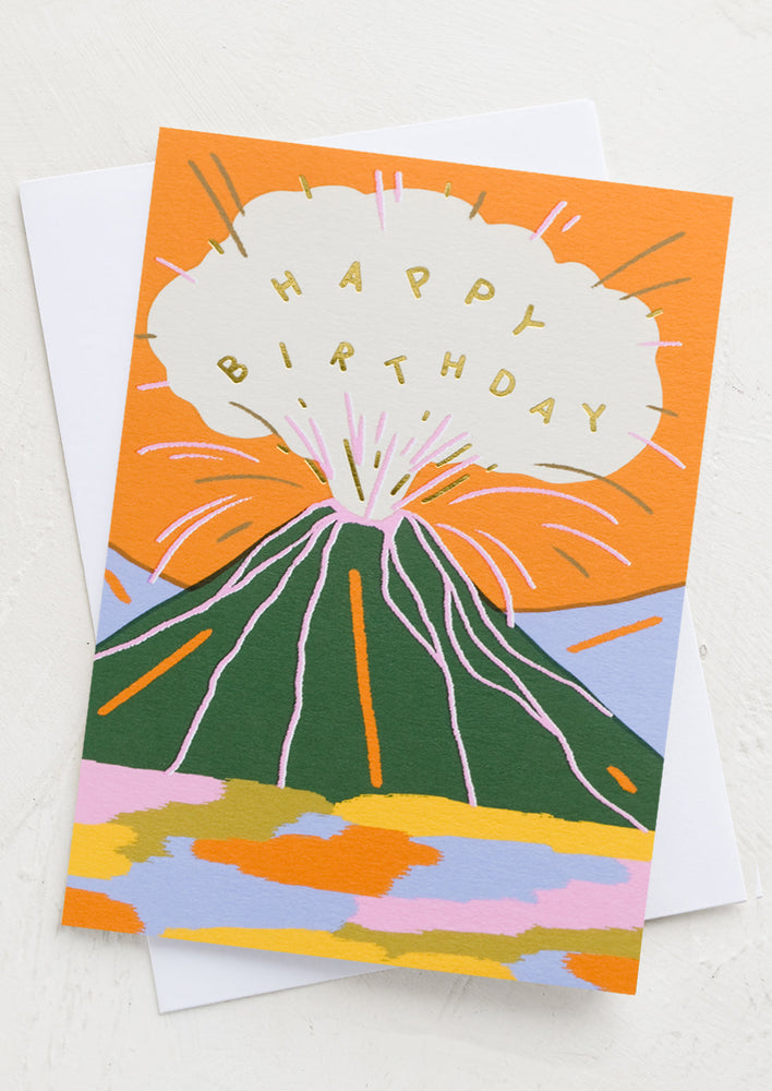 1: A birthday card with illustrated graphic of exploding volcano reading "Happy Birthday".