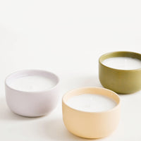 1: Small scented candles in colorful ceramic vessels