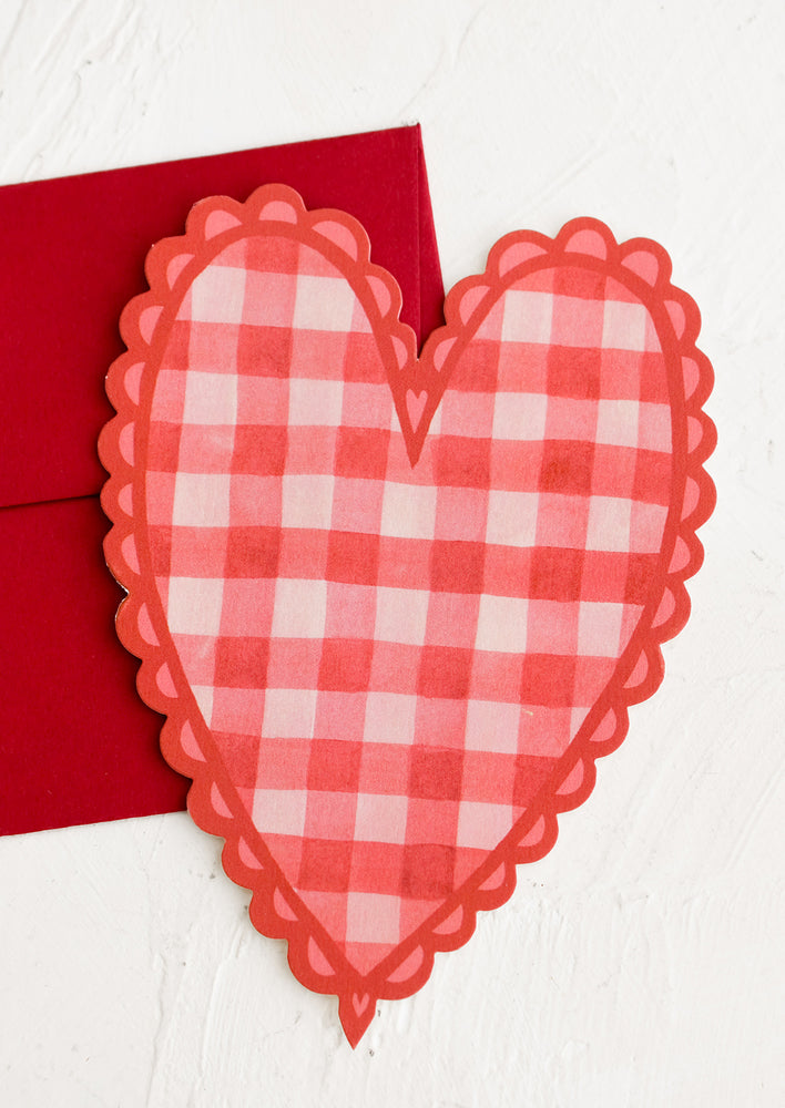 A heart shaped card in red gingham print.
