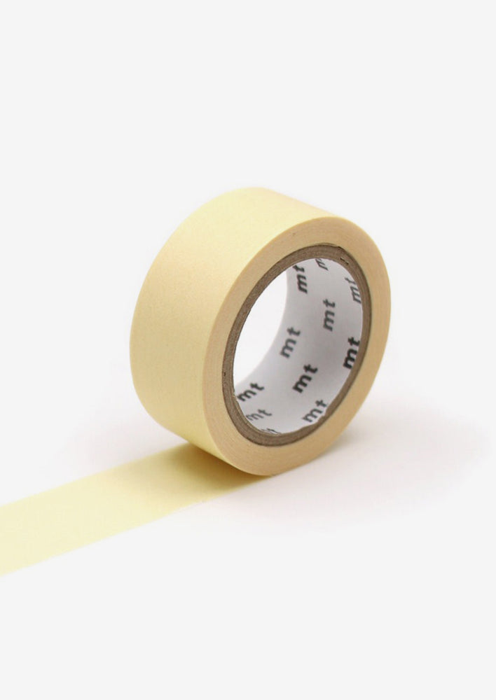 A roll of washi tape in butter yellow color.
