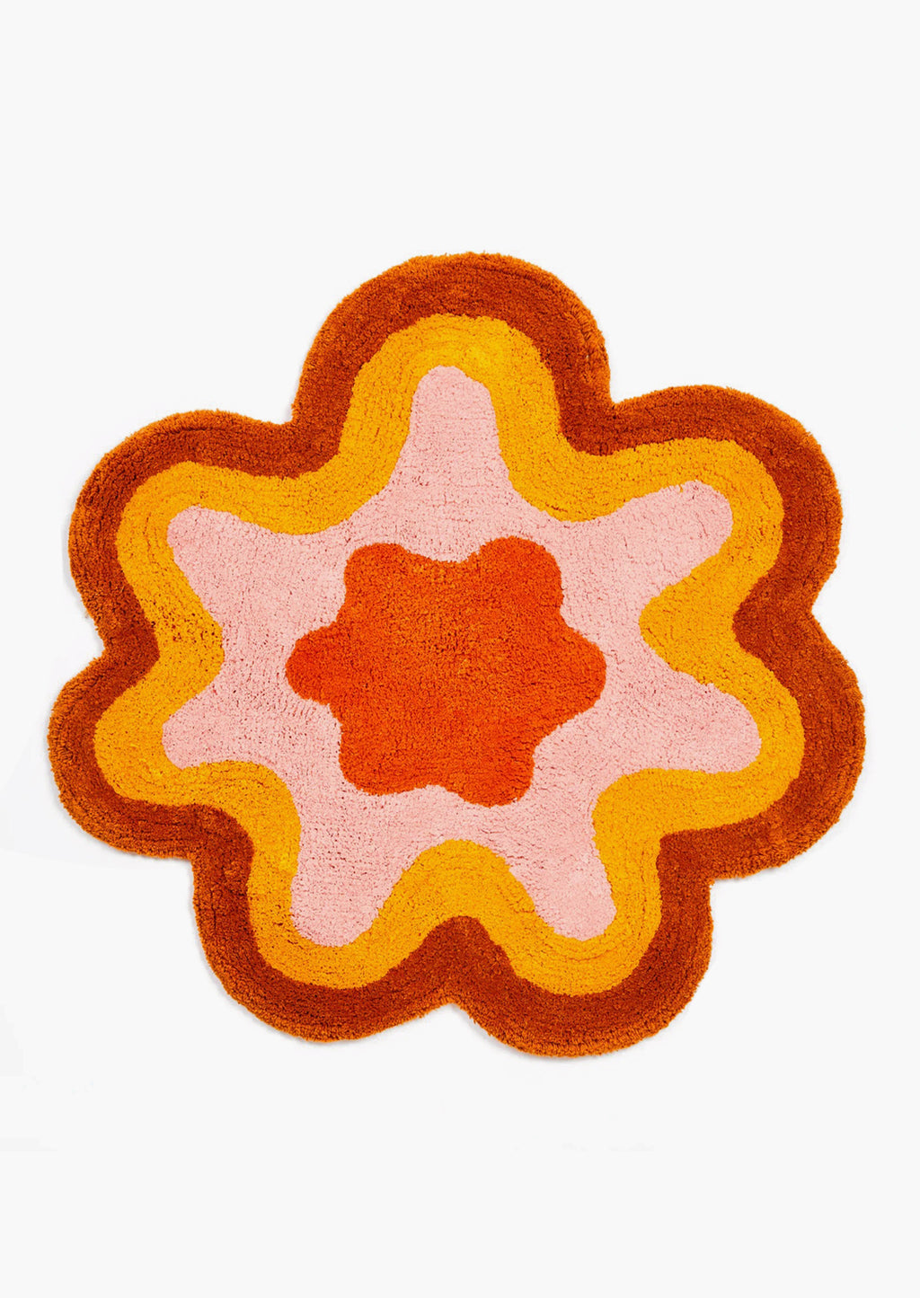 Rust / Orange Multi: A wavy edge flower shaped bath mat in rust and orange.