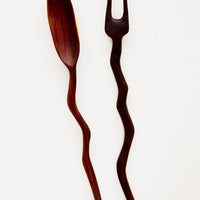 1: Two piece spoon and fork teak wood serving set, in a primitive silhouette with wavy handles