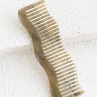 Stone: A wavy shaped acetate comb in stone grey.