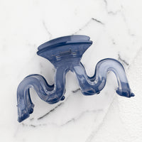 Storm Blue: A wavy squiggle hair claw in storm blue.