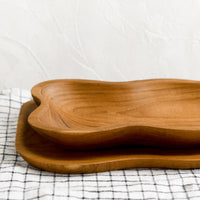 3: Rectangular teakwood tray/bowls with wavy edges.