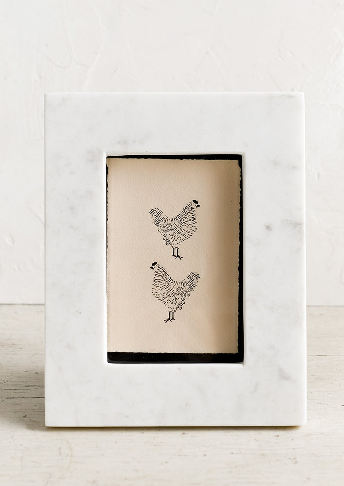 A white marble picture frame.
