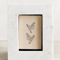 1: A white marble picture frame.