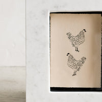 2: A white marble picture frame.