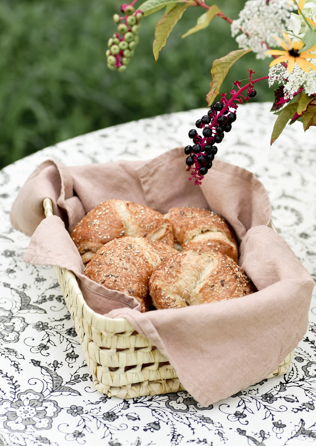 Tea Rose: A woven basket lined with linen tea towel holding croissants.