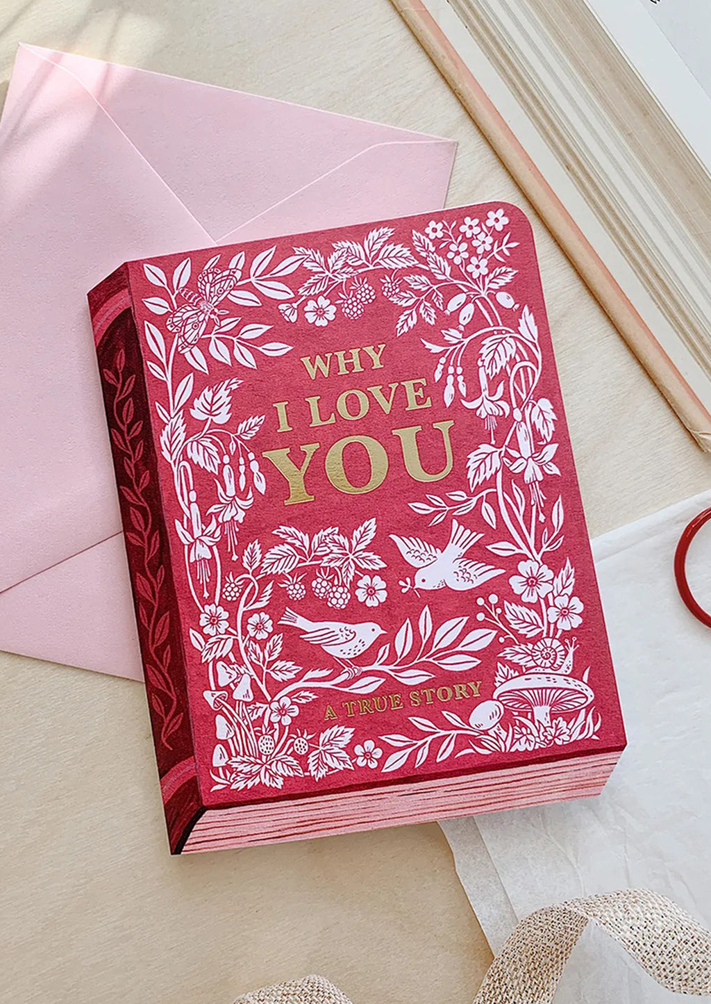 2: A card made to look like a book, reading "Why I love you — a true story".