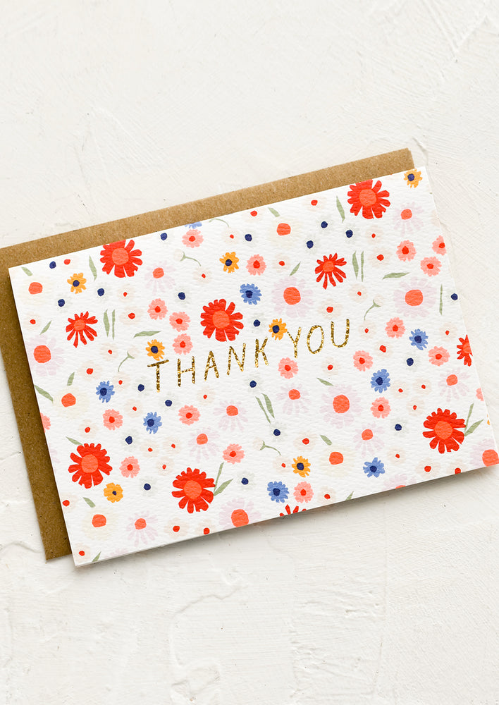 Single Card: A card with neon floral print and glittery gold text reading "THANK YOU".