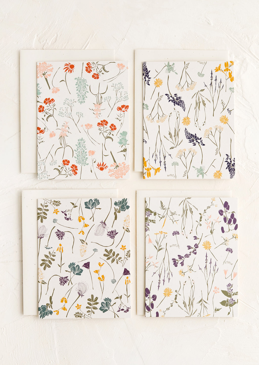 2: Four cards with wildflower patterns in slightly different designs and colors.