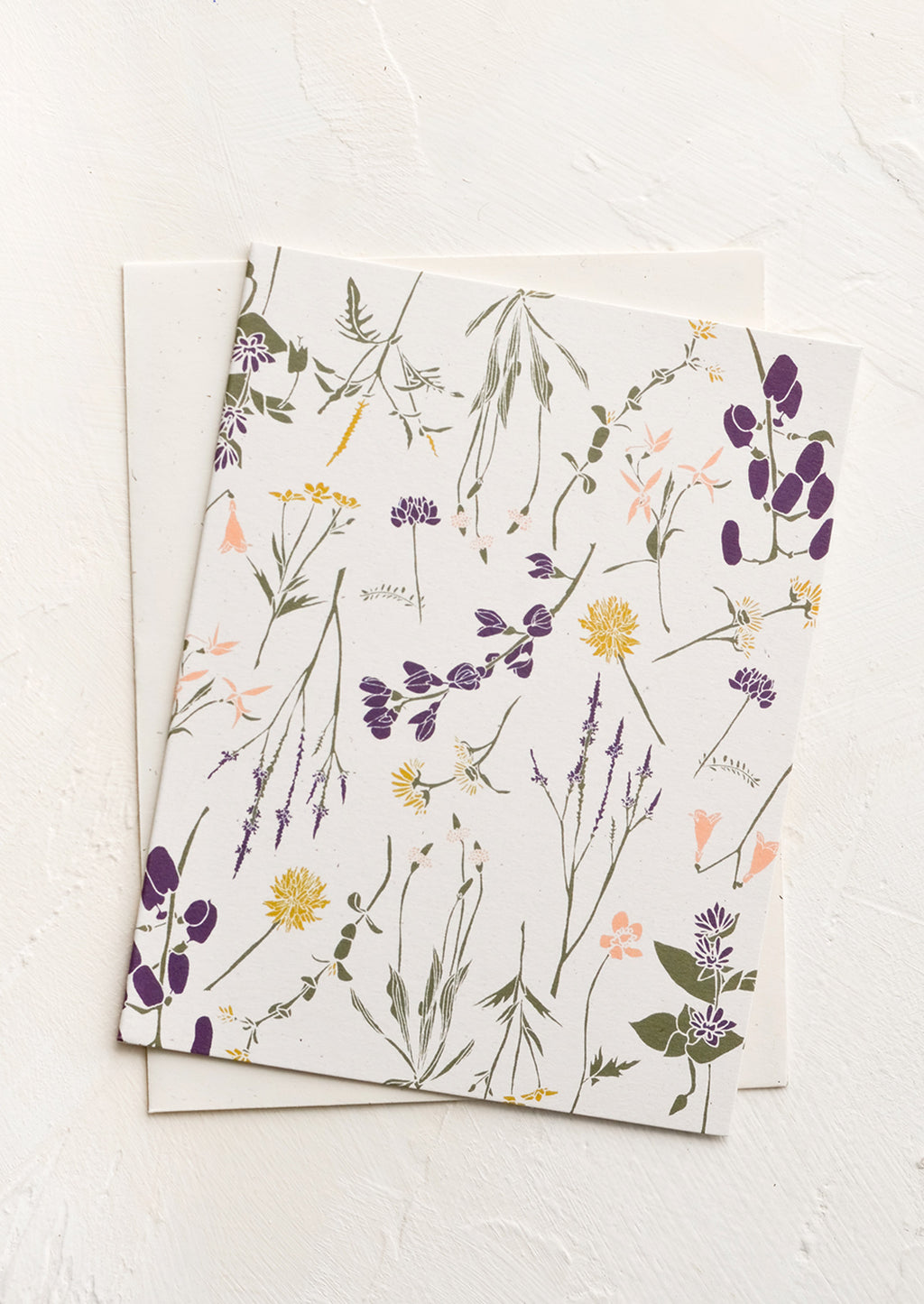 White Wildflowers: A greeting card with white background and floral print.