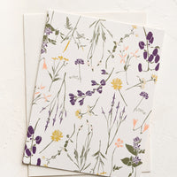 White Wildflowers: A greeting card with white background and floral print.