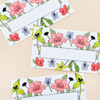 1: Mini, business card-sized notecards with floral border and area in center for text