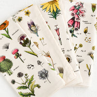 1: A set of four cotton napkins with colorful botanical wildflower print.