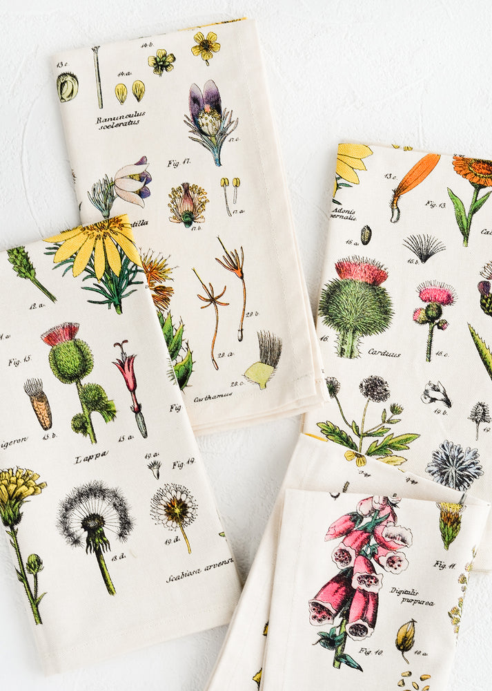 A set of four cotton napkins with colorful botanical wildflower print.