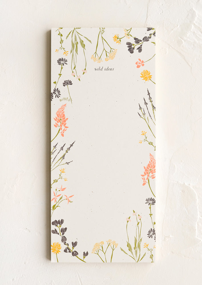 A list making notepad with "wild ideas" printed at top with a decorative botanical border.
