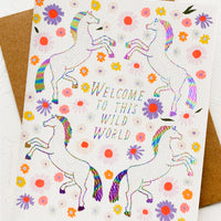 1: A greeting card with unicorn floral print, text reads "Welcome to this wild world".
