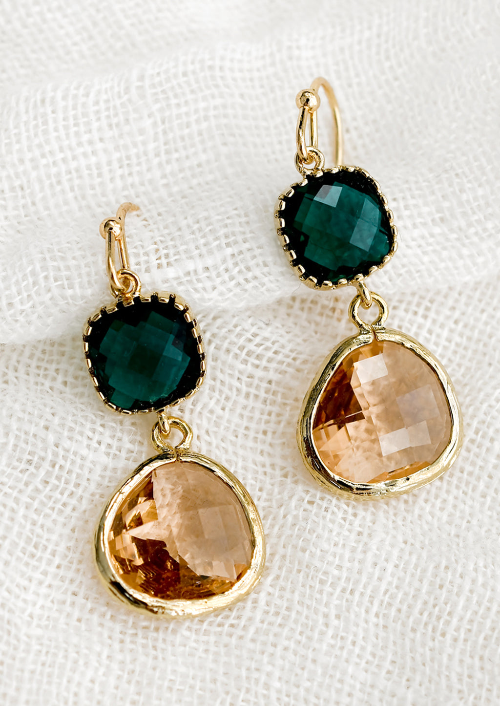Emerald / Peach: A pair of two-stone bezeled gem earrings in emerald and blush.