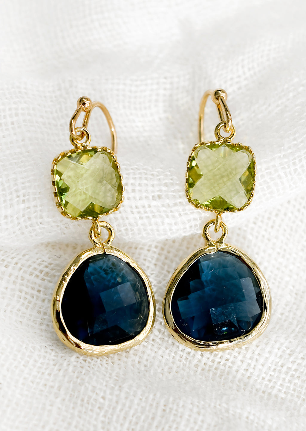 Peridot / Ocean: A pair of two-stone bezeled gem earrings in peridot and ocean blue.